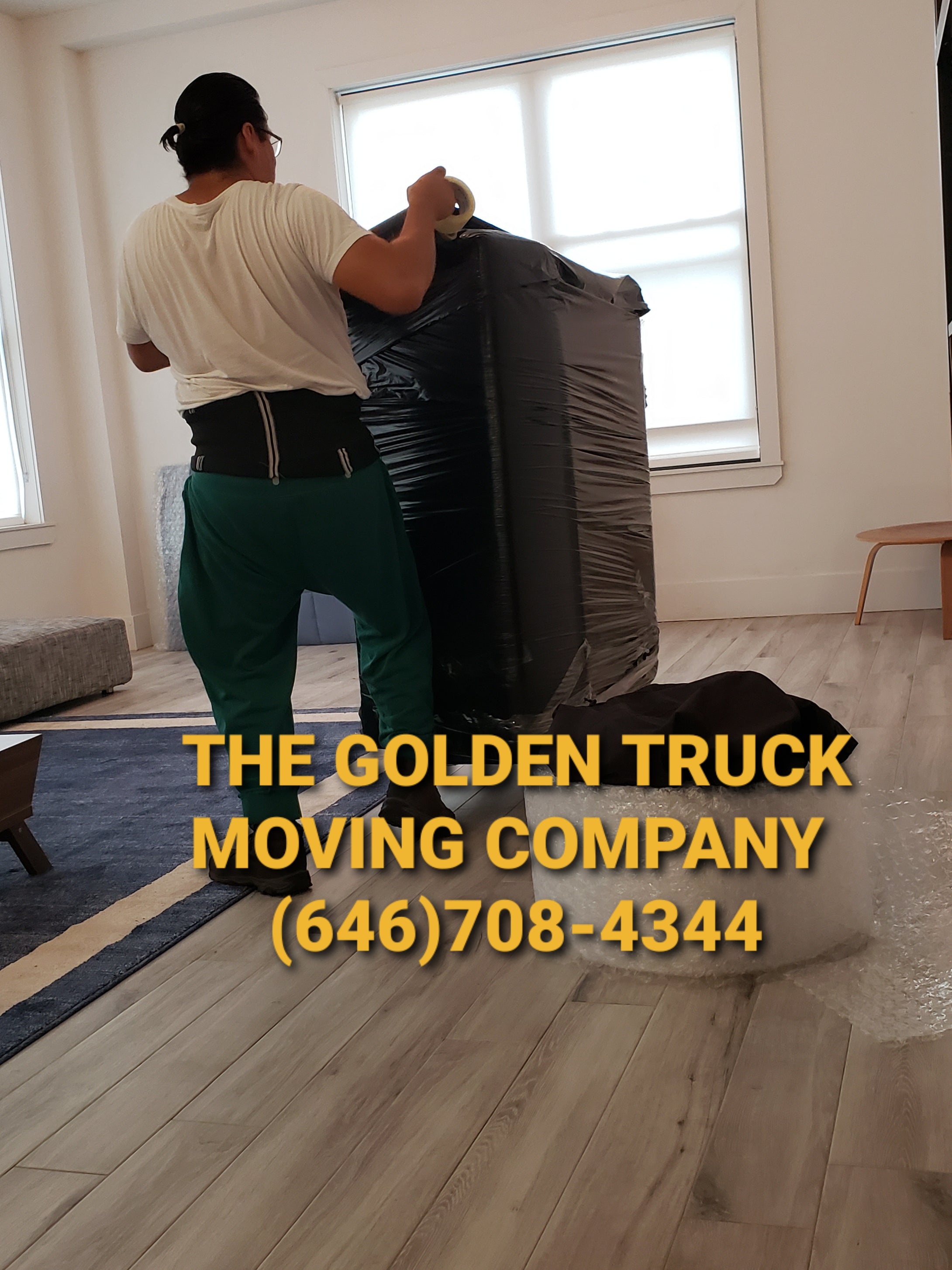 Professional local movers in Brooklyn NYC loading a moving truck